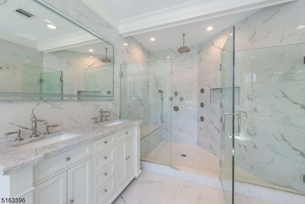 Bathroom, Dual Sink Vanities, Glass Shower, Interior, Marble, Marble Walls, Recessed Lighting