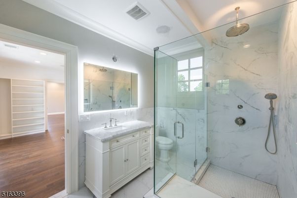 Bathroom, Glass Shower, Interior, Marble Walls, Recessed Lighting, Wood Texture Flooring