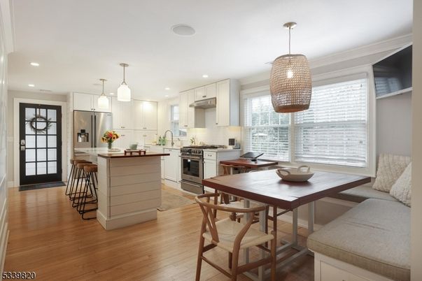 Dining room, Interior, Kitchen, Pendant Lights, Recessed Lighting, Stainless Steel Appliances, Wood Texture Flooring