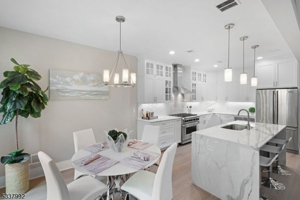Dining room, Interior, Kitchen, Pendant Lights, Recessed Lighting, Stainless Steel Appliances, Wood Texture Flooring