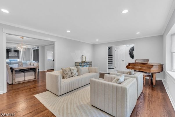 Chandelier, Dining room, Interior, Living room, Piano, Recessed Lighting, Wood Texture Flooring