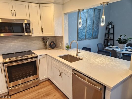 Dining room, Interior, Kitchen, Pendant Lights, Stainless Steel Appliances, Wood Texture Flooring