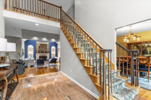 Chandelier, Dining room, Fireplace, Interior, Living room, Recessed Lighting, Wood Texture Flooring
