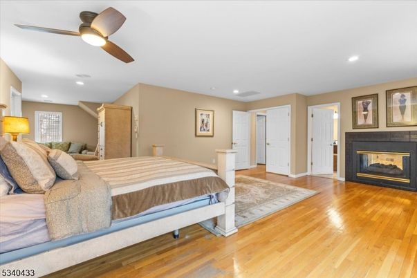 Bedroom, Fireplace, Interior, Recessed Lighting, Wood Texture Flooring