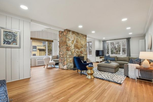Fireplace, Interior, Living room, Recessed Lighting, Stone Walls, Wood Texture Flooring