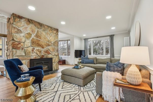 Fireplace, Interior, Living room, Recessed Lighting, Stone Walls, Wood Texture Flooring