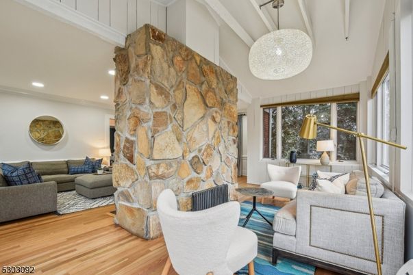 Fireplace, Interior, Living room, Pendant Lights, Recessed Lighting, Stone Walls, Wood Texture Flooring
