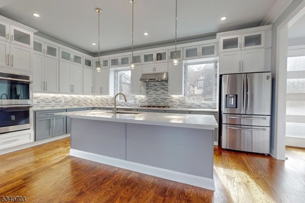 Interior, Kitchen, Pendant Lights, Recessed Lighting, Stainless Steel Appliances, Wood Texture Flooring