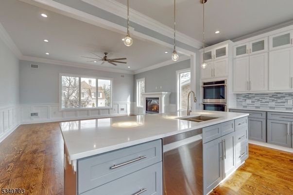 Fireplace, Interior, Kitchen, Pendant Lights, Recessed Lighting, Stainless Steel Appliances, Wood Texture Flooring
