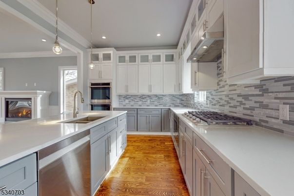Fireplace, Interior, Kitchen, Pendant Lights, Recessed Lighting, Stainless Steel Appliances, Wood Texture Flooring