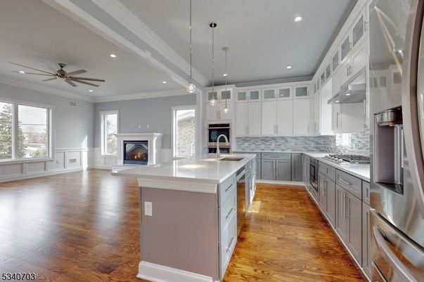 Fireplace, Interior, Kitchen, Pendant Lights, Recessed Lighting, Stainless Steel Appliances, Wood Texture Flooring