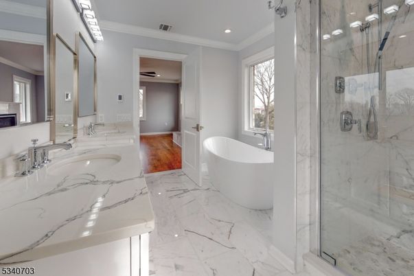 Bathroom, Dual Sink Vanities, Fireplace, Free Standing Baths, Glass Shower, Interior, Marble, Marble Walls, Recessed Lighting, Wood Texture Flooring