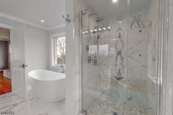 Bathroom, Free Standing Baths, Glass Shower, Interior, Marble, Marble Walls, Recessed Lighting, Wood Texture Flooring
