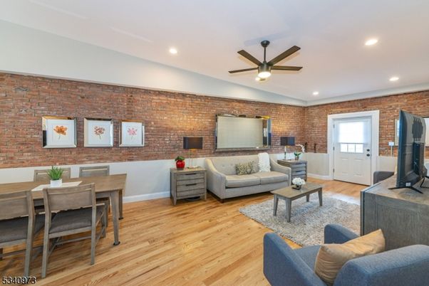 Dining room, Interior, Living room, Recessed Lighting, Stone Walls, Wood Texture Flooring
