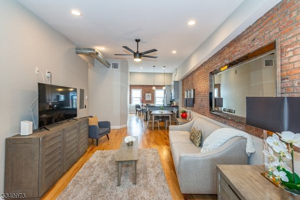 Dining room, Interior, Kitchen, Living room, Pendant Lights, Recessed Lighting, Stone Walls, Wood Texture Flooring
