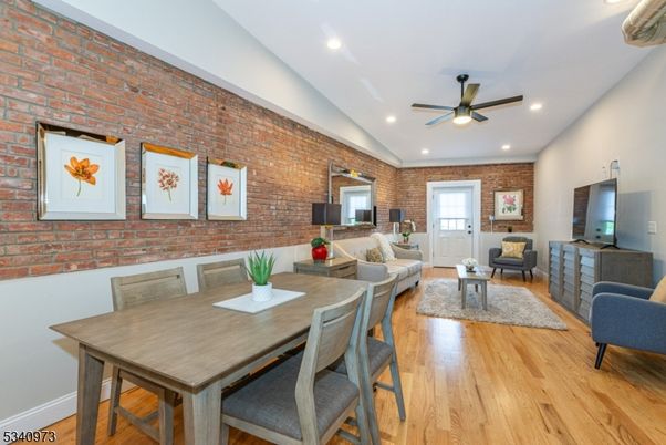 Dining room, Interior, Living room, Recessed Lighting, Stone Walls, Wood Texture Flooring