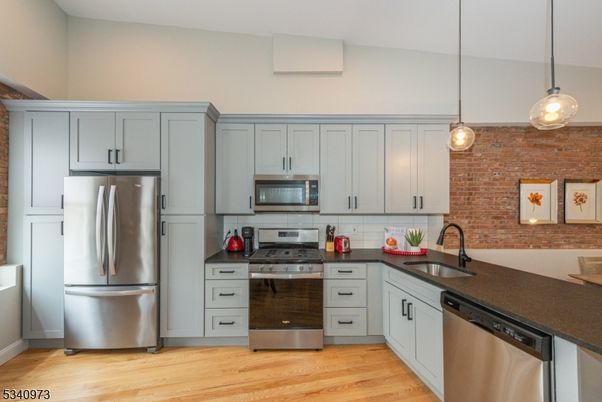 Interior, Kitchen, Pendant Lights, Stainless Steel Appliances, Stone Walls, Wood Texture Flooring