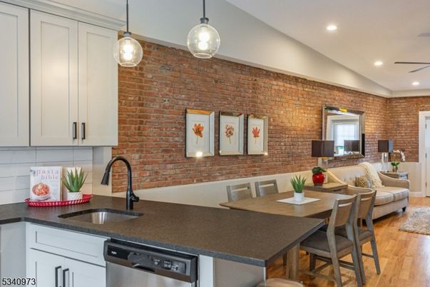 Dining room, Interior, Kitchen, Pendant Lights, Recessed Lighting, Stainless Steel Appliances, Stone Walls, Wood Texture Flooring
