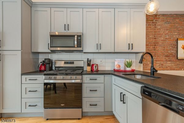 Interior, Kitchen, Pendant Lights, Stainless Steel Appliances, Stone Walls, Wood Texture Flooring