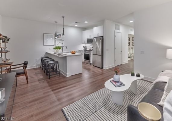 Dining room, Interior, Kitchen, Pendant Lights, Recessed Lighting, Stainless Steel Appliances, Wood Texture Flooring