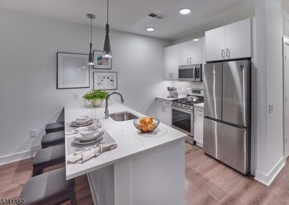 Interior, Kitchen, Pendant Lights, Recessed Lighting, Stainless Steel Appliances, Wood Texture Flooring