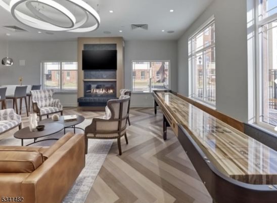 Dining room, Fireplace, Interior, Living room, Pendant Lights, Recessed Lighting, Wood Texture Flooring