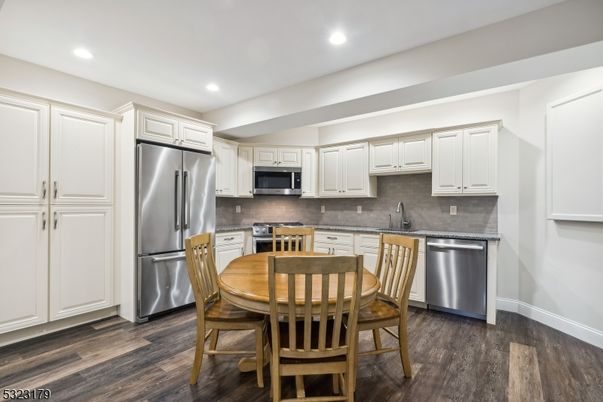 Dining room, Interior, Kitchen, Recessed Lighting, Stainless Steel Appliances, Wood Texture Flooring