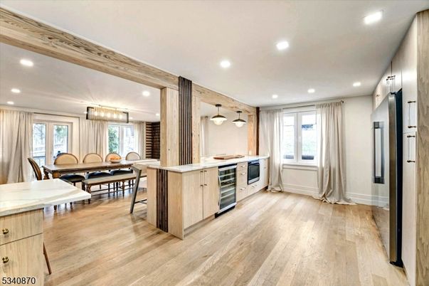 Chandelier, Dining room, Interior, Kitchen, Pendant Lights, Recessed Lighting, Stainless Steel Appliances, Wood Texture Flooring