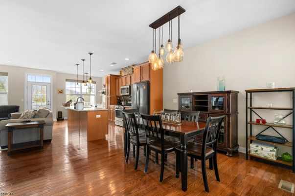 Dining room, Interior, Kitchen, Living room, Pendant Lights, Recessed Lighting, Stainless Steel Appliances, Wood Texture Flooring