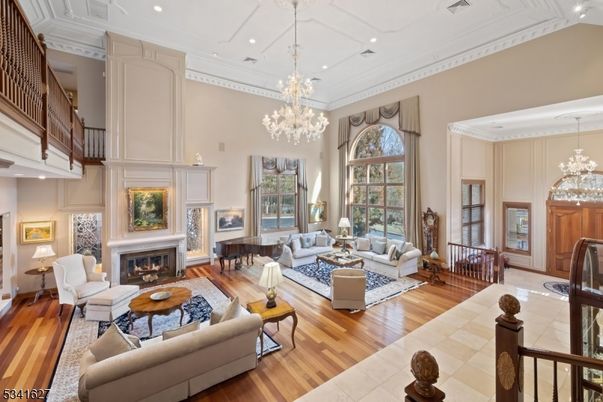 Chandelier, Fireplace, Interior, Living room, Piano, Recessed Lighting, Wood Texture Flooring