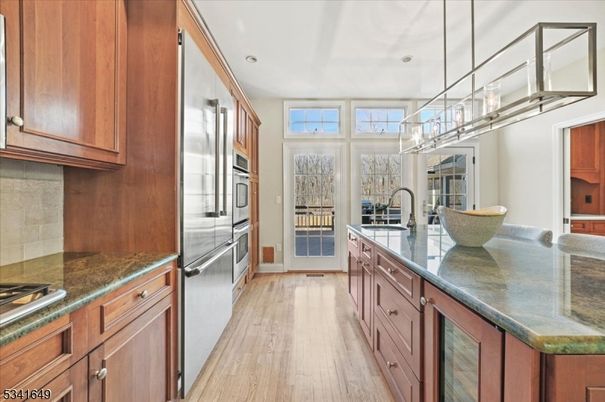 Chandelier, Interior, Kitchen, Pendant Lights, Recessed Lighting, Stainless Steel Appliances, Wood Texture Flooring