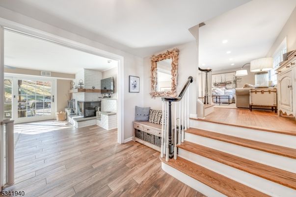 Chandelier, Fireplace, Interior, Living room, Pendant Lights, Recessed Lighting, Wood Texture Flooring