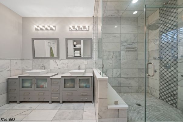 Bathroom, Dual Sink Vanities, Glass Shower, Interior, Marble Walls, Recessed Lighting