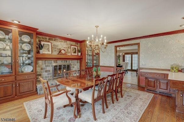 Chandelier, Dining room, Fireplace, Interior, Recessed Lighting, Wood Texture Flooring