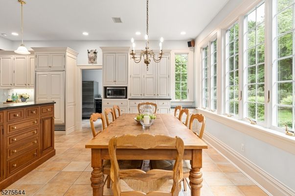 Chandelier, Dining room, Interior, Kitchen, Pendant Lights, Recessed Lighting, Stainless Steel Appliances
