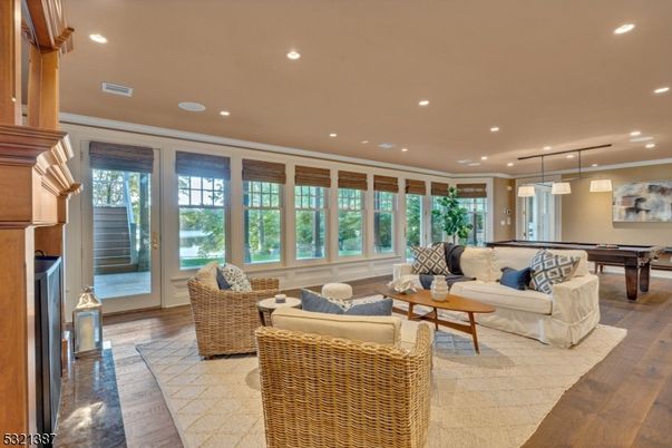 Billiard Table, Fireplace, Game Room, Interior, Living room, Pendant Lights, Recessed Lighting, Wood Texture Flooring