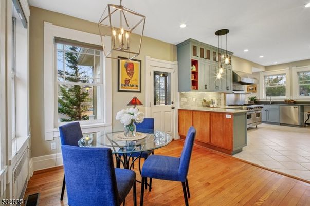 Dining room, Interior, Kitchen, Pendant Lights, Recessed Lighting, Stainless Steel Appliances, Wood Texture Flooring