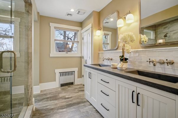 Bathroom, Dual Sink Vanities, Glass Shower, Interior, Recessed Lighting, Wood Texture Flooring