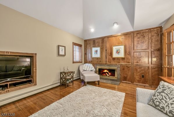 Fireplace, Interior, Living room, Recessed Lighting, Wood Texture Flooring, Wooden Walls
