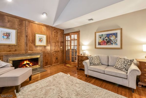 Bedroom, Fireplace, Interior, Living room, Recessed Lighting, Wood Texture Flooring, Wooden Walls