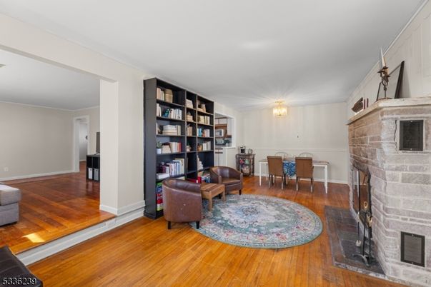 Chandelier, Dining room, Fireplace, Interior, Stone Walls, Wood Texture Flooring