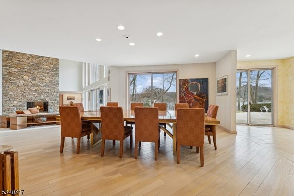 Dining room, Fireplace, Interior, Recessed Lighting, Stone Walls, Wood Texture Flooring