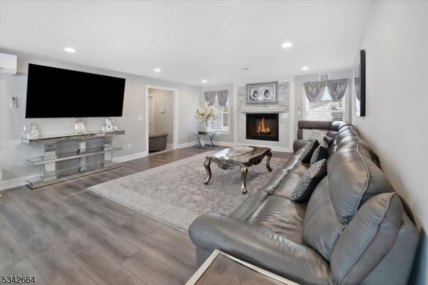 Fireplace, Interior, Living room, Recessed Lighting, Wood Texture Flooring