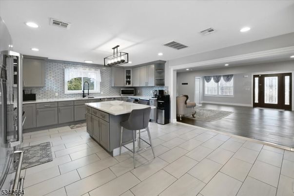 Chandelier, Interior, Kitchen, Recessed Lighting, Stainless Steel Appliances, Wood Texture Flooring