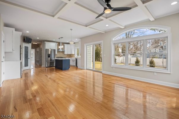 Empty room, Interior, Kitchen, Pendant Lights, Recessed Lighting, Stainless Steel Appliances, Wood Texture Flooring