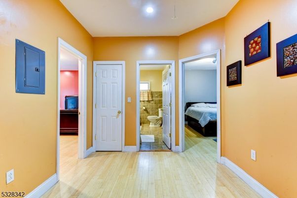 Bathroom, Bedroom, Glass Shower, Interior, Recessed Lighting, Wood Texture Flooring