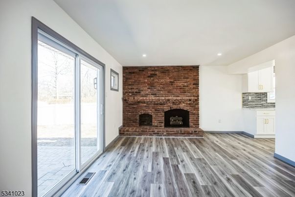 Fireplace, Interior, Recessed Lighting, Stone Walls, Wood Texture Flooring