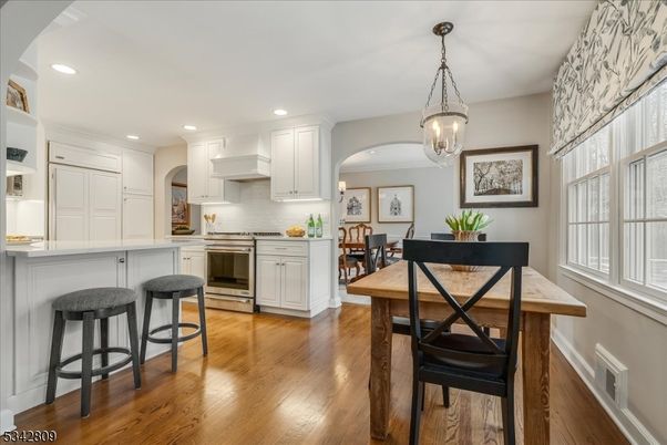 Dining room, Interior, Kitchen, Pendant Lights, Recessed Lighting, Stainless Steel Appliances, Wood Texture Flooring