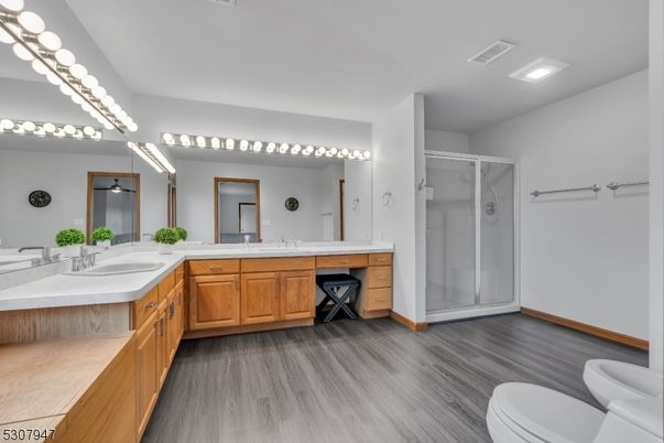 Bathroom, Dual Sink Vanities, Glass Shower, Interior, Recessed Lighting, Wood Texture Flooring
