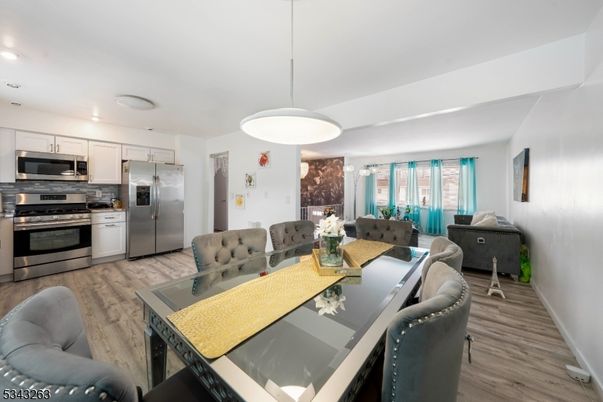 Dining room, Interior, Kitchen, Pendant Lights, Recessed Lighting, Stainless Steel Appliances, Wood Texture Flooring